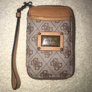 New tan Guess purse never used .